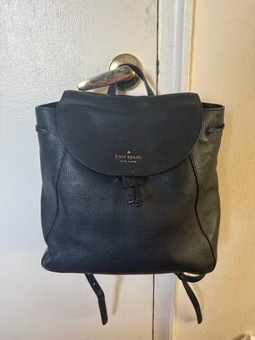 kate spade Black Pebbled Leather Drawstring Backpack with Gold Logo